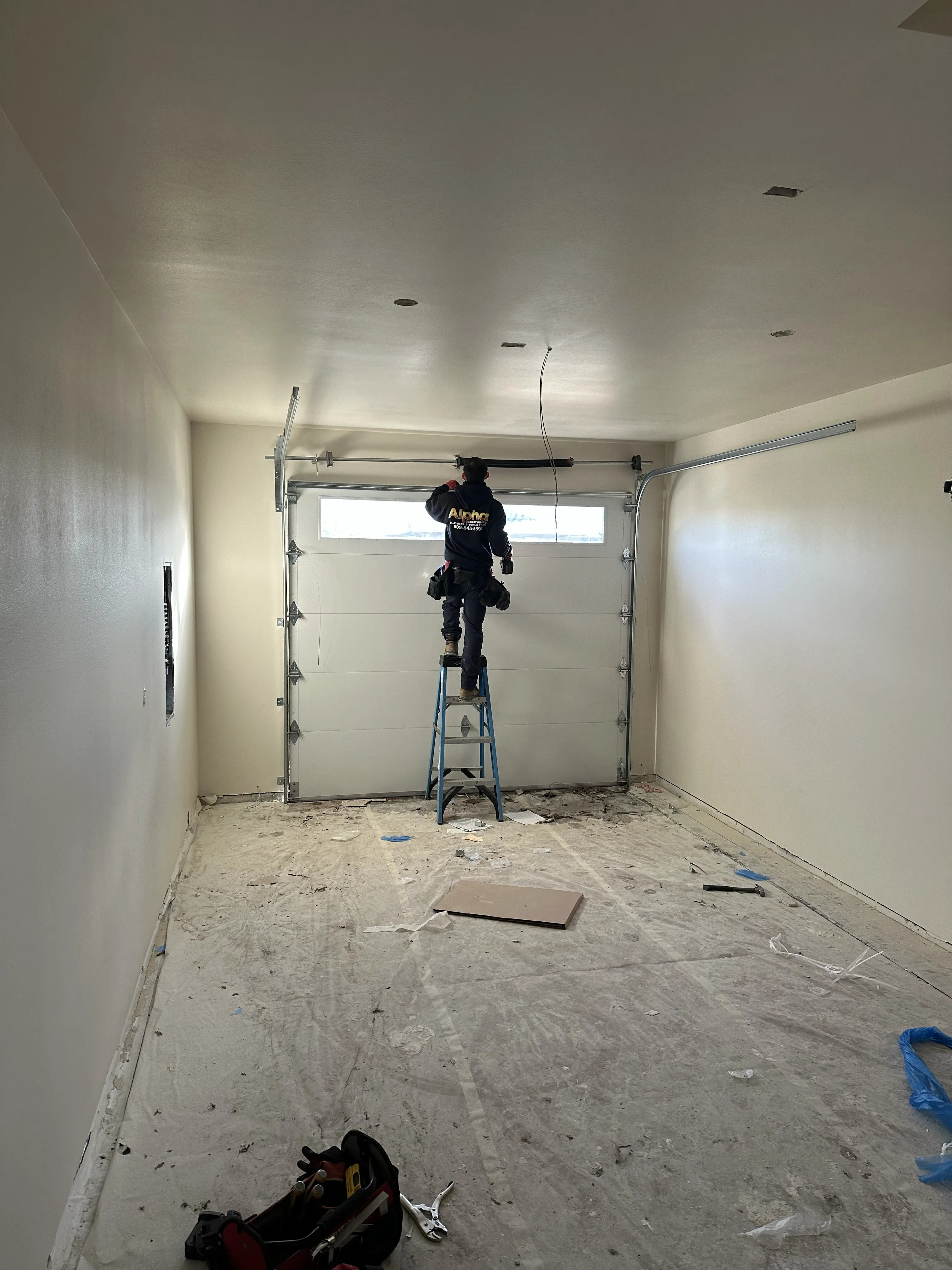 alpha garage doors team at work narrow door