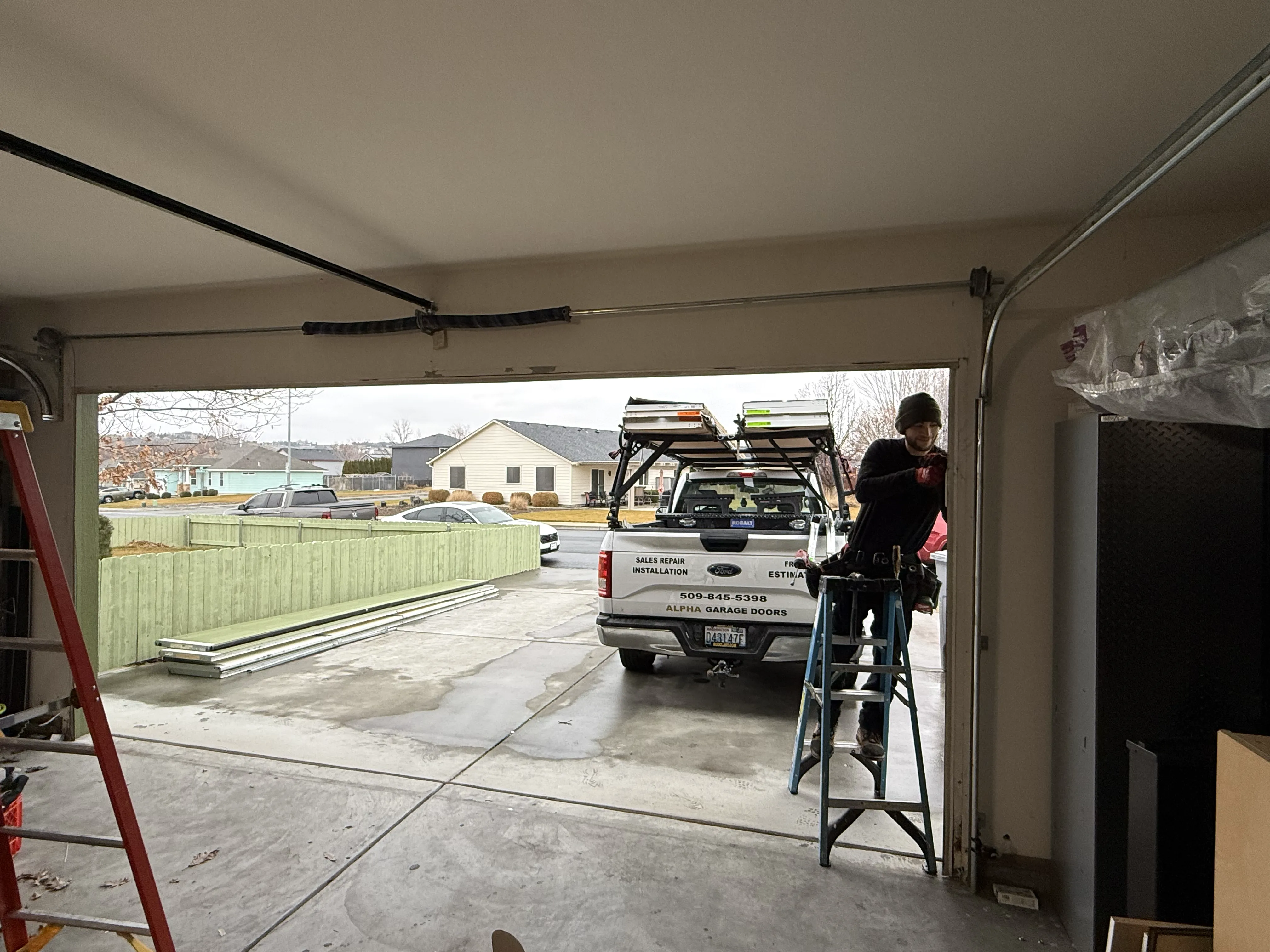alpha garage doors team at work wide door