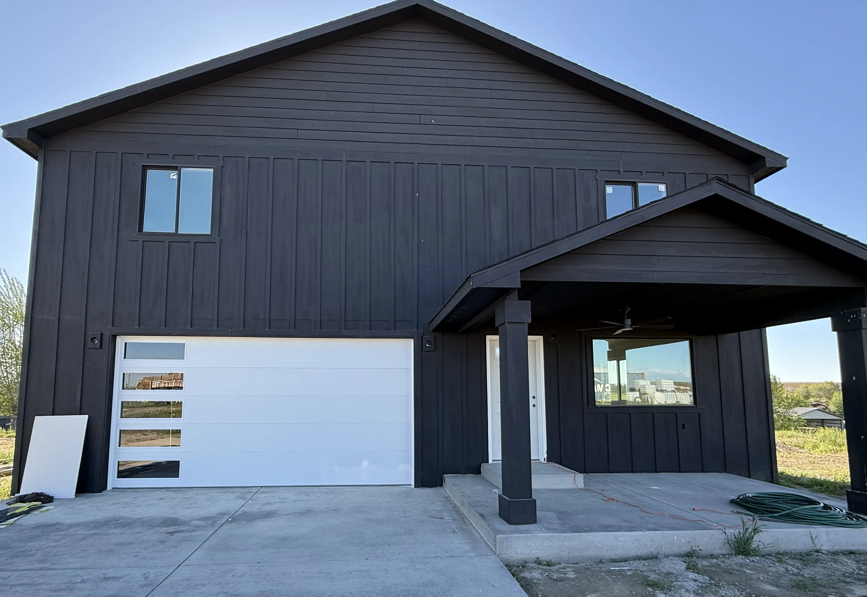 residential garage door flush design with windows white color