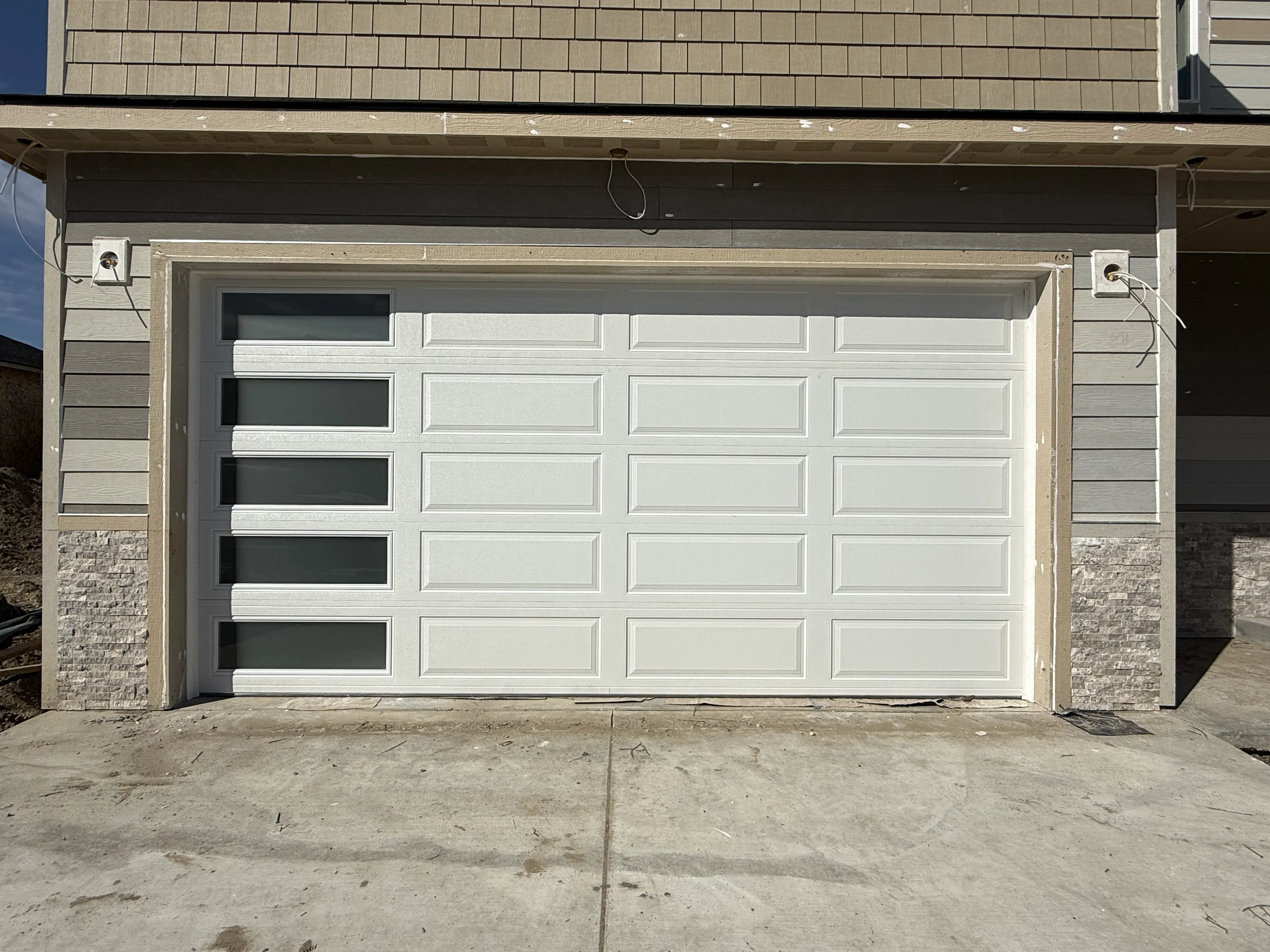 residential garage door ranch design with windows on the left side white color